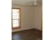 Bedroom with ceiling fan, window, and wood-look flooring at 710 Austin St # 124, Albemarle, NC 28001