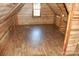 Large attic room with wood paneling and wood-look flooring at 710 Austin St # 124, Albemarle, NC 28001