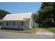 Quaint one-story home with a front porch and mature trees at 710 Austin St # 124, Albemarle, NC 28001