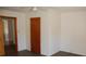 Bedroom with wood door and wood-look flooring at 710 Austin St # 124, Albemarle, NC 28001