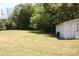 Large backyard with grassy area and a white shed at 710 Austin St # 124, Albemarle, NC 28001