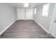 Bedroom with double closets and gray wood-look floors at 412 Lakeview Dr, Wadesboro, NC 28170