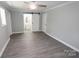 Main bedroom with barn door to bathroom and gray floors at 412 Lakeview Dr, Wadesboro, NC 28170
