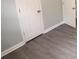 Gray flooring, white doors and light walls in a freshly updated bedroom at 412 Lakeview Dr, Wadesboro, NC 28170
