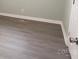 Simple bedroom with gray wood-look floors at 412 Lakeview Dr, Wadesboro, NC 28170