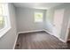 Spacious bedroom with grey flooring, light walls, and large windows at 412 Lakeview Dr, Wadesboro, NC 28170