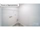 Laundry room with shelving and hookups at 7765 Woolsey Dr, Gastonia, NC 28056