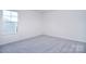 Simple bedroom with gray carpet and a window at 108 Megby Trl, Statesville, NC 28677