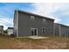 Gray siding two-story house, with a backyard and patio at 108 Megby Trl, Statesville, NC 28677