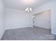 Spacious dining room with hardwood floors and chandelier at 108 Megby Trl, Statesville, NC 28677
