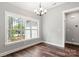 Bright dining room features hardwood floors and a large window at 121 Arboretum Way, Shelby, NC 28152