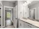 Modern bathroom with granite countertop, white cabinets, and a walk-in shower at 121 Arboretum Way, Shelby, NC 28152