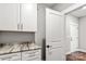 Laundry room with white cabinets and granite countertop at 121 Arboretum Way, Shelby, NC 28152