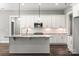 White kitchen cabinets, granite counters and island at 121 Arboretum Way, Shelby, NC 28152