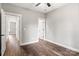 Well-lit bedroom with hardwood floors and access to other rooms at 121 Arboretum Way, Shelby, NC 28152