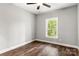 Spacious bedroom with dark hardwood floors and a ceiling fan at 121 Arboretum Way, Shelby, NC 28152