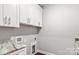 Laundry room with white cabinets and granite countertop at 121 Arboretum Way, Shelby, NC 28152