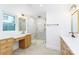 Elegant bathroom with double vanity, marble shower, and gold fixtures at 7362 Hemlock Ct, Denver, NC 28037