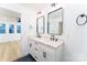 Double vanity bathroom with quartz countertop and black fixtures at 7362 Hemlock Ct, Denver, NC 28037