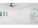 Bright bedroom with ceiling fan, windows, and walk-in closet at 7362 Hemlock Ct, Denver, NC 28037