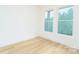 Bedroom with hardwood floors and large windows offering natural light at 7362 Hemlock Ct, Denver, NC 28037