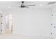 Spacious bedroom with ceiling fan and access to bathroom at 7362 Hemlock Ct, Denver, NC 28037