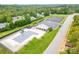 Aerial view of community pool, playground, and tennis courts at 7362 Hemlock Ct, Denver, NC 28037