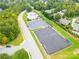 Aerial view of community amenities including tennis courts and parking at 7362 Hemlock Ct, Denver, NC 28037