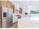 Stainless steel appliances and white cabinetry highlight this kitchen at 7362 Hemlock Ct, Denver, NC 28037