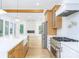 Modern kitchen with stainless steel appliances and light wood cabinets at 7362 Hemlock Ct, Denver, NC 28037