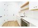 Walk-in pantry with white cabinets, shelving and quartz countertop at 7362 Hemlock Ct, Denver, NC 28037