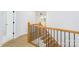 Elegant wooden staircase with black metal balusters at 7362 Hemlock Ct, Denver, NC 28037