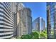 City view with high-rise buildings and lush green trees at 139 S Tryon St # 6, Charlotte, NC 28202