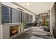 Covered balcony offering comfortable seating, a fireplace, and a grill at 139 S Tryon St # 6, Charlotte, NC 28202