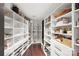 Large walk-in pantry with ample shelving for storage at 139 S Tryon St # 6, Charlotte, NC 28202