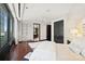 Bright bedroom with hardwood floors and built-in shelving at 139 S Tryon St # 6, Charlotte, NC 28202