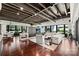 Open living area with hardwood floors, high ceilings, and modern decor at 139 S Tryon St # 6, Charlotte, NC 28202