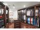 Spacious walk-in closet with custom built-ins and a comfortable seating area at 139 S Tryon St # 6, Charlotte, NC 28202