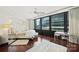 Spacious bedroom with hardwood floors and city views at 139 S Tryon St # 6, Charlotte, NC 28202