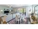 Bright dining room with chandelier and seating for six at 4830 Looking Glass Trl, Denver, NC 28037