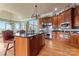 Gourmet kitchen boasts stainless steel appliances and rich wood cabinetry at 590-0 Tuckertown Rd, New London, NC 28127