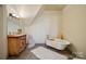 Bathroom with clawfoot tub, unique vanity, and decorative accents at 590-0 Tuckertown Rd, New London, NC 28127