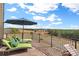 Relaxing deck with lounge chairs, umbrella, and scenic countryside views at 590-0 Tuckertown Rd, New London, NC 28127