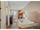 Luxurious bathroom with a large jetted tub and tile flooring at 590-0 Tuckertown Rd, New London, NC 28127