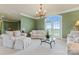 Bright sitting area with comfortable sofas and French doors at 590-0 Tuckertown Rd, New London, NC 28127