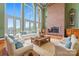 Spacious living room with a brick fireplace and large windows at 590-0 Tuckertown Rd, New London, NC 28127