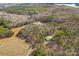 Aerial view of property showing home and surrounding land at 590-0 Tuckertown Rd, New London, NC 28127