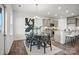 Elegant dining area with an oval table and modern lighting fixture at 11106 Glasden Rd # 279, Charlotte, NC 28278