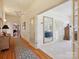 Hallway with hardwood floors and views into other rooms at 4809 Us 74 Hwy, Wingate, NC 28174