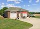 Detached brick garage with a seating area and basketball hoop at 4809 Us 74 Hwy, Wingate, NC 28174